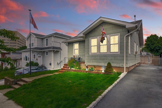 bungalow featuring a yard