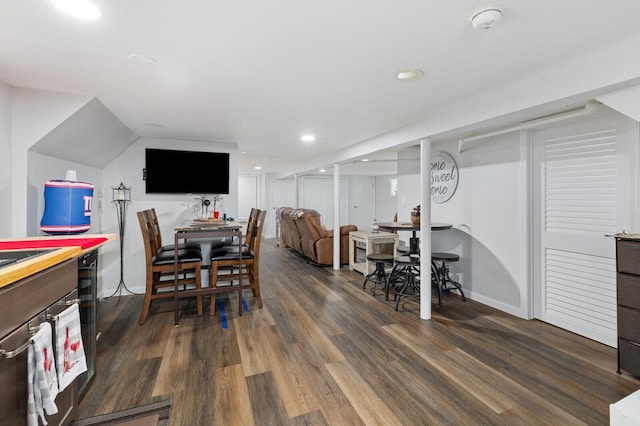 playroom with dark wood-type flooring and recessed lighting