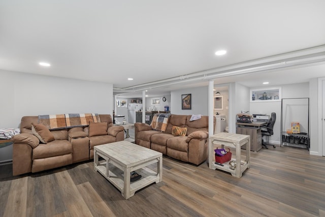 living room with wood finished floors, an office area, and recessed lighting