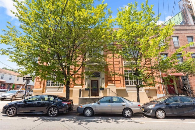 9 Coles St Unit 7, Jersey City, NJ 07302 - view of property hidden behind natural elements featuring brick siding