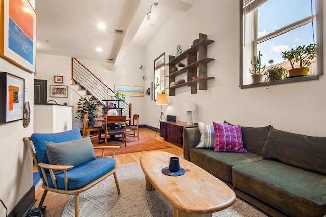 9 Coles St Unit 7, Jersey City, NJ 07302 - living room featuring wood finished floors, stairs, and recessed lighting