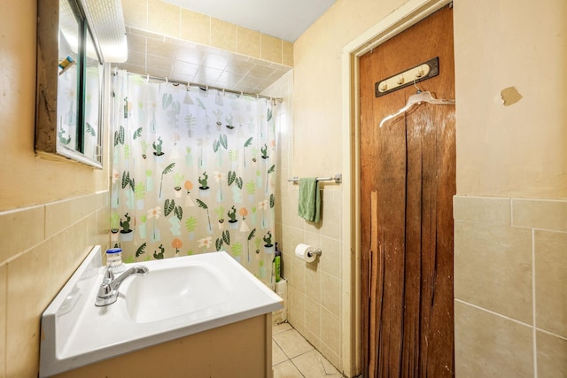 47 Darling Ave, Bloomfield, NJ 07003 - full bath with tile walls, vanity, tile patterned flooring, and a shower with shower curtain