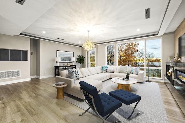 living room featuring a chandelier and hardwood / wood-style flooring