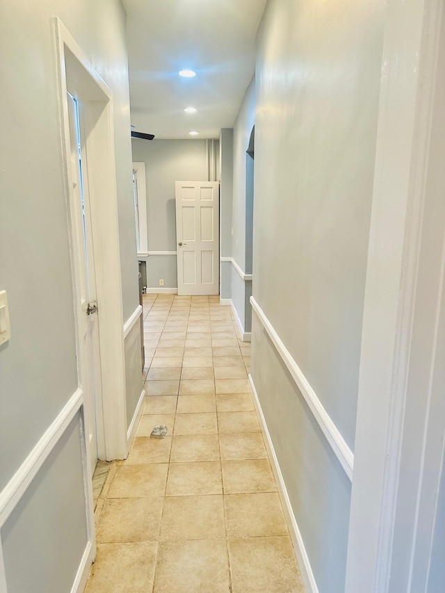 hallway featuring light tile patterned floors