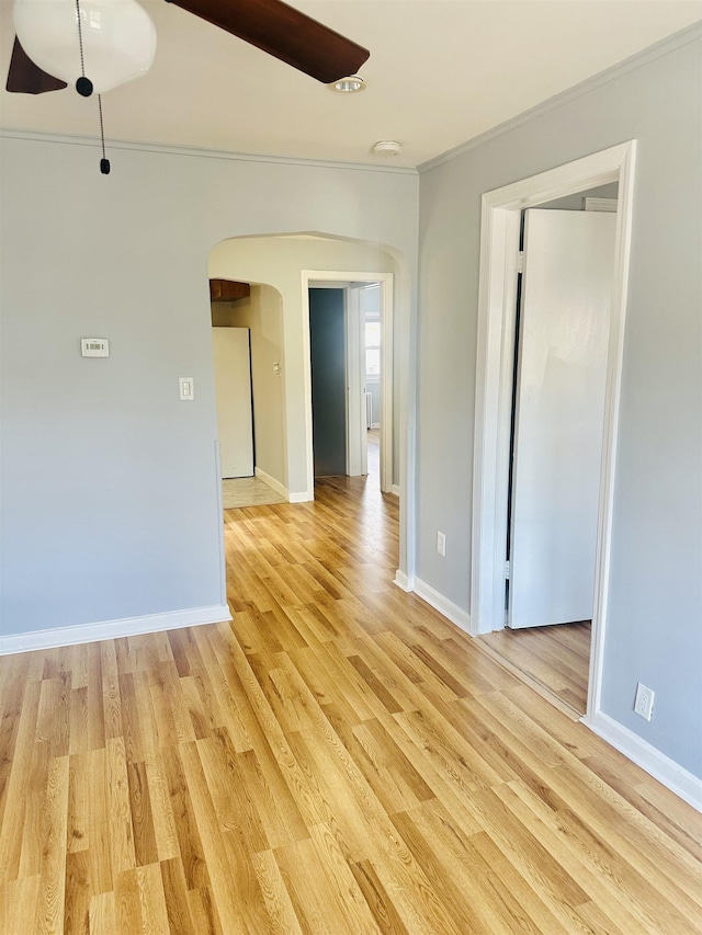 unfurnished room featuring light hardwood / wood-style flooring and ornamental molding