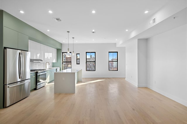 322 3rd St Unit D, Jersey City, NJ 07302 - kitchen with stainless steel appliances, a kitchen island, light countertops, recessed lighting, and modern cabinets