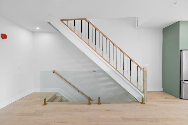 322 3rd St Unit D, Jersey City, NJ 07302 - stairway with wood finished floors and recessed lighting
