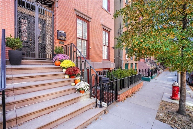 277 2nd St Unit 1, Jersey City, NJ 07302 - property entrance featuring brick siding and fence
