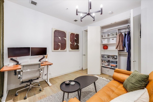 277 2nd St Unit 1, Jersey City, NJ 07302 - home office featuring a chandelier and wood finished floors