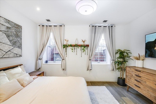 277 2nd St Unit 1, Jersey City, NJ 07302 - bedroom featuring multiple windows, wood finished floors, and baseboards