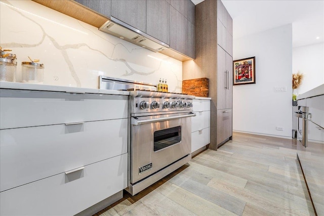 277 2nd St Unit 1, Jersey City, NJ 07302 - kitchen featuring luxury range, modern cabinets, and light wood-style flooring