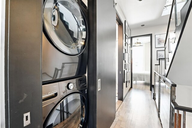 33 Willow Ter, Hoboken, NJ 07030 - washroom featuring stacked washer / drying machine and wood finished floors