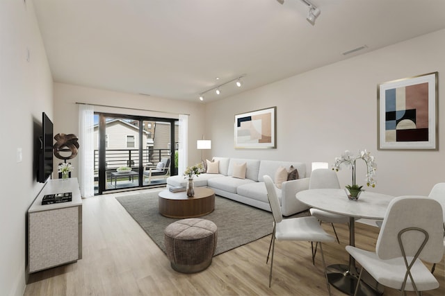 391 Palisade Ave Unit 202, Jersey City, NJ 07307 - living area featuring track lighting and wood finished floors