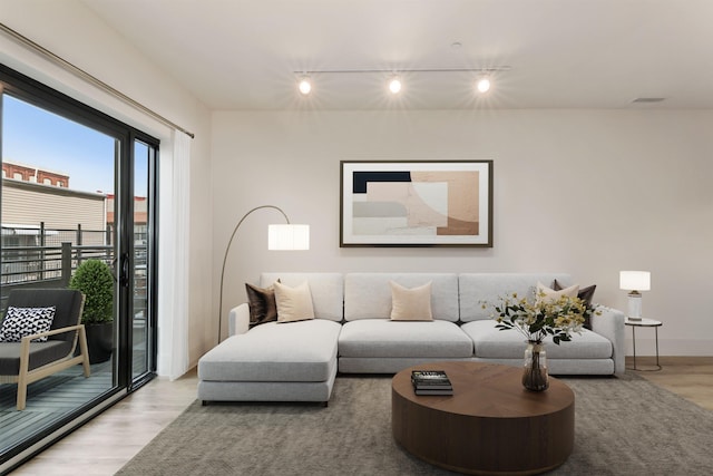 391 Palisade Ave Unit 202, Jersey City, NJ 07307 - living area featuring track lighting and wood finished floors