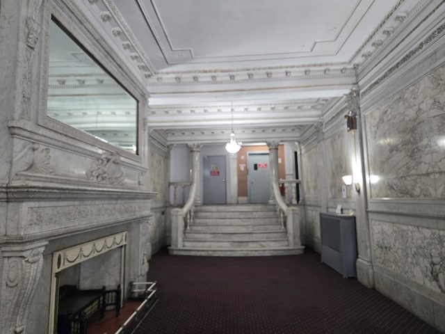 hallway with electric panel, crown molding, decorative columns, and dark carpet