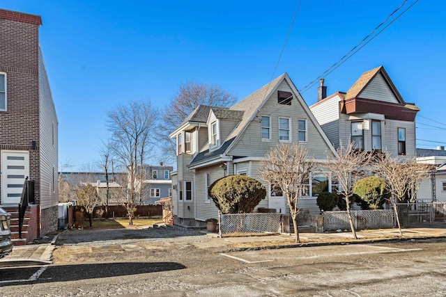 view of front of house featuring fence private yard and entry steps