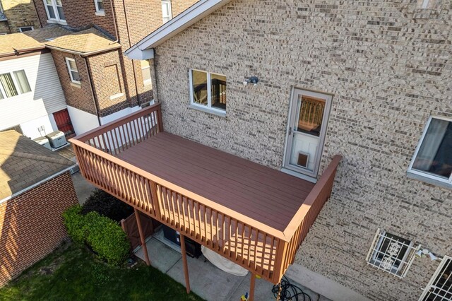 wooden terrace featuring central AC unit