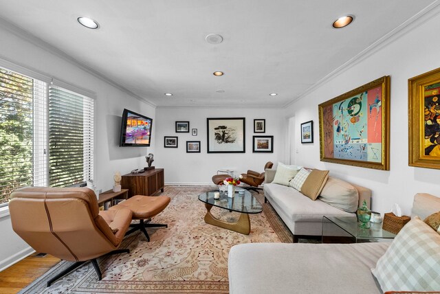 living area featuring crown molding, recessed lighting, and wood finished floors