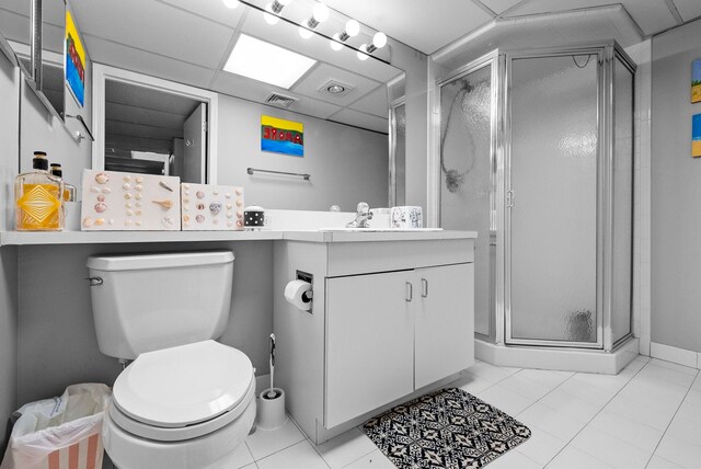 full bathroom featuring visible vents, tile patterned flooring, a stall shower, vanity, and toilet