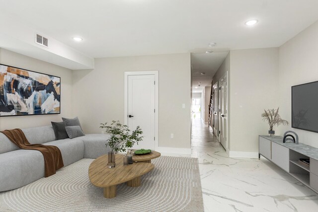 97 Irving St Unit 1, Jersey City, NJ 07307 - living room with light marble finish floors, recessed lighting, and baseboards