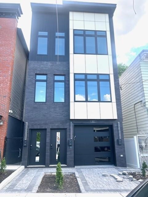 97 Irving St Unit 1, Jersey City, NJ 07307 - view of property featuring fence