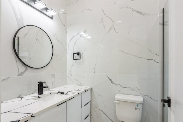 97 Irving St Unit 1, Jersey City, NJ 07307 - bathroom featuring tile walls, vanity, and toilet