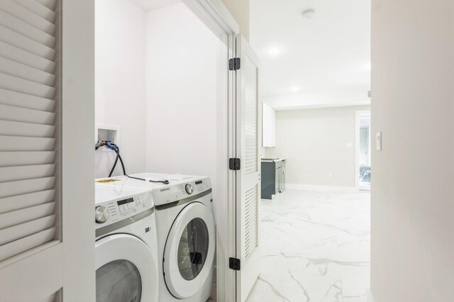 97 Irving St Unit 1, Jersey City, NJ 07307 - clothes washing area with light marble finish flooring, separate washer and dryer, and recessed lighting