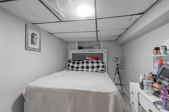 6910 Jackson St, Guttenberg, NJ 07093 - bedroom featuring a paneled ceiling and light tile patterned floors