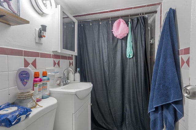 6910 Jackson St, Guttenberg, NJ 07093 - bathroom featuring vanity, tile walls, and a shower with shower curtain
