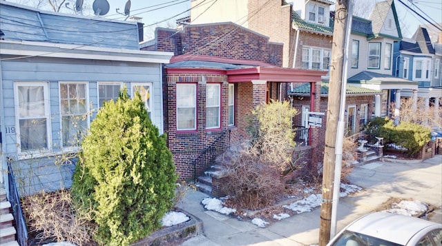 view of side of property with brick siding