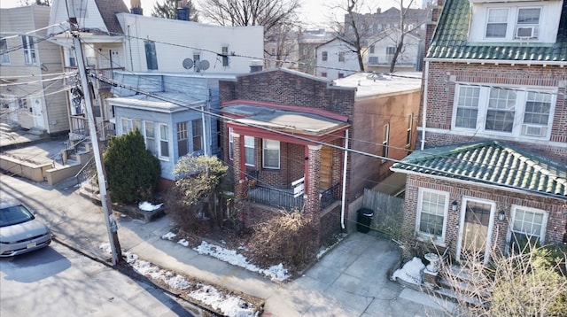 view of property exterior featuring brick siding