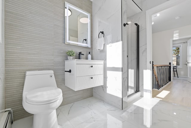 bathroom featuring a baseboard heating unit, marble finish floor, toilet, and a marble finish shower