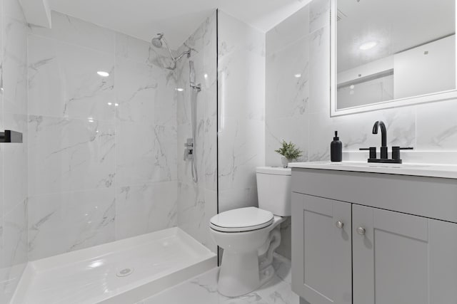 bathroom with a marble finish shower, marble finish floor, vanity, and toilet