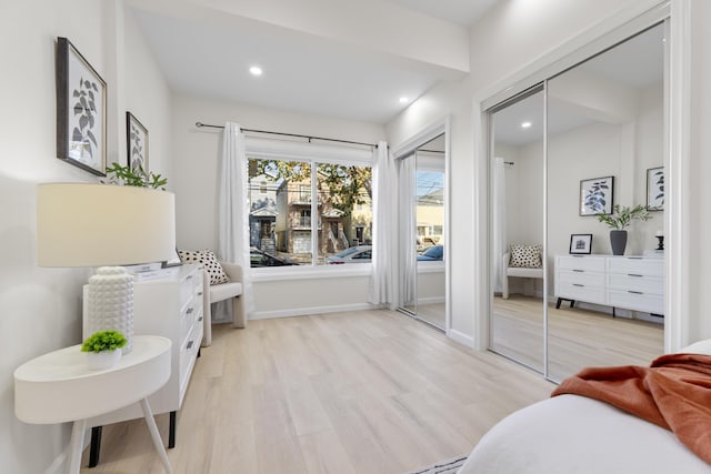 interior space with light wood-style flooring, baseboards, and recessed lighting