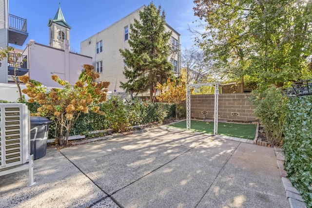 view of patio / terrace with cooling unit and fence