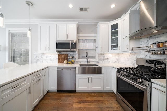 61 Skillman Ave Unit 3A, Jersey City, NJ 07306 - kitchen with appliances with stainless steel finishes, wall chimney range hood, white cabinetry, decorative backsplash, and recessed lighting