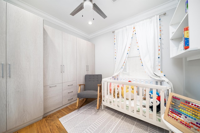61 Skillman Ave Unit 3A, Jersey City, NJ 07306 - bedroom featuring ornamental molding, wood finished floors, a crib, ceiling fan, and recessed lighting