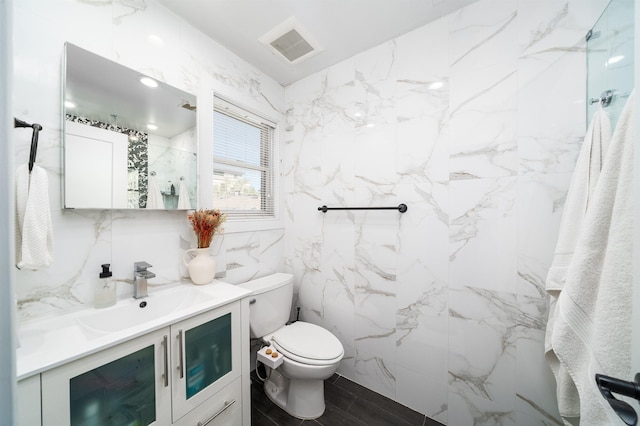 61 Skillman Ave Unit 3A, Jersey City, NJ 07306 - bathroom featuring vanity, tile walls, and a marble finish shower