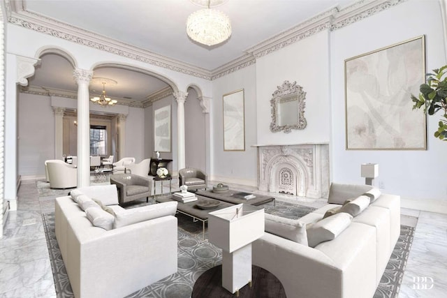 living room with ornate columns, crown molding, and an inviting chandelier