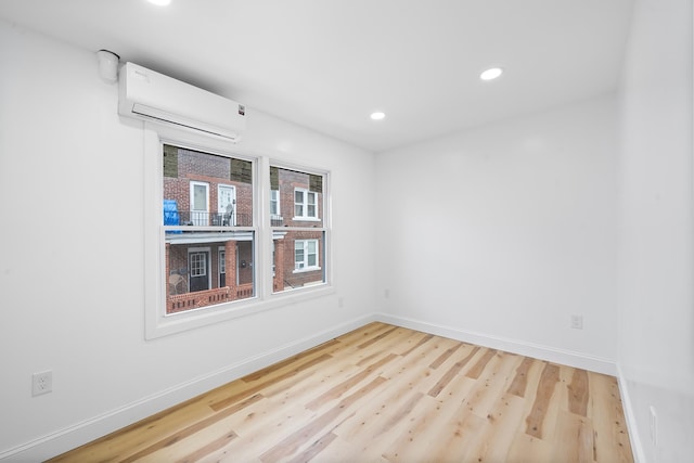 1 Sisson Ct, Bayonne, NJ 07002 - unfurnished room featuring a wall mounted AC, wood finished floors, baseboards, and recessed lighting