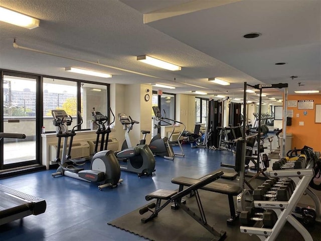 workout area with a textured ceiling