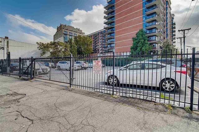 view of gate with fence