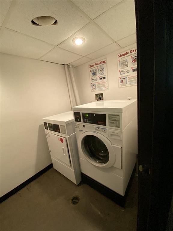 common laundry area featuring independent washer and dryer and baseboards