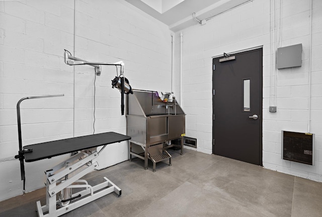 720 Clinton St Unit 6-03, Hoboken, NJ 07030 - misc room with pet washing station, finished concrete flooring, concrete block wall, and heating unit