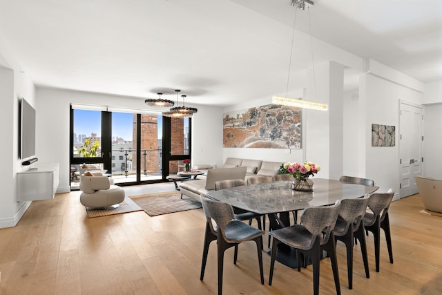 720 Clinton St Unit 6-03, Hoboken, NJ 07030 - dining room featuring light wood-type flooring