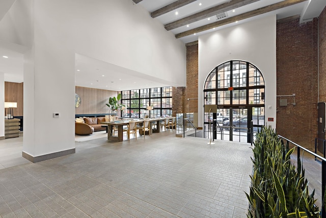 720 Clinton St Unit 6-03, Hoboken, NJ 07030 - building lobby featuring a high ceiling, recessed lighting, and beamed ceiling