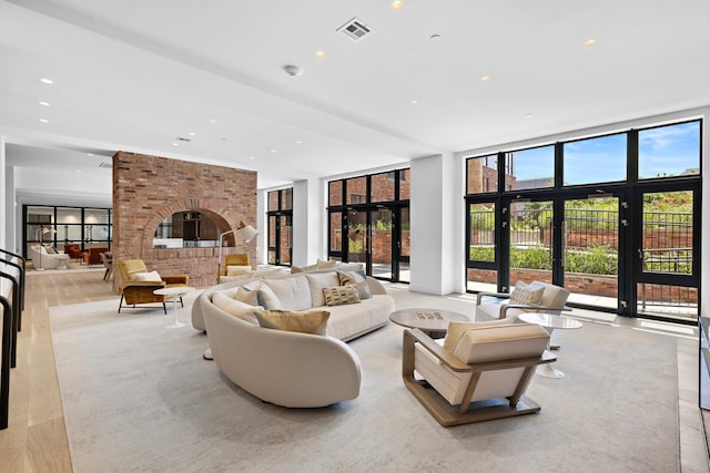 720 Clinton St Unit 6-03, Hoboken, NJ 07030 - living room featuring recessed lighting, expansive windows, and a fireplace