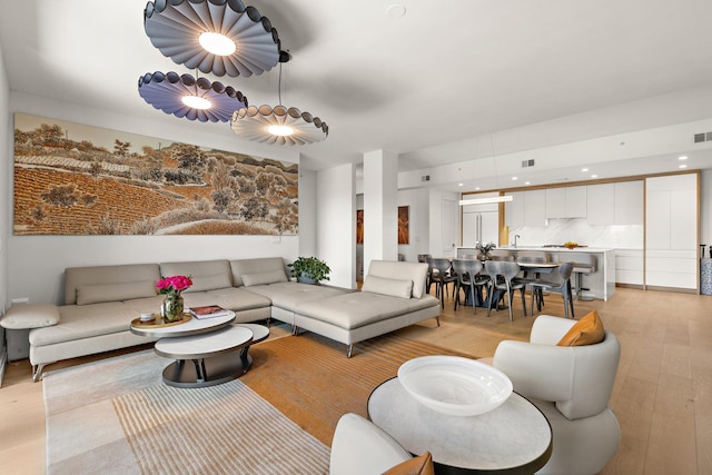 720 Clinton St Unit 6-03, Hoboken, NJ 07030 - living room featuring light wood finished floors and recessed lighting