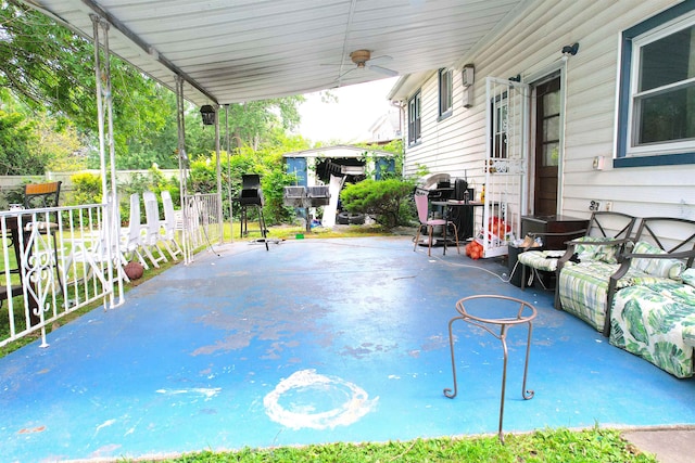 view of patio featuring ceiling fan