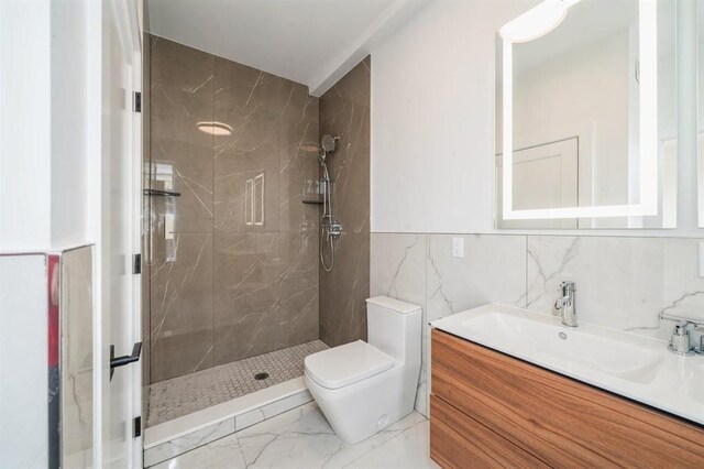 160 Brunswick St Unit 302, Jersey City, NJ 07302 - full bath featuring marble finish floors, a tile shower, vanity, and toilet